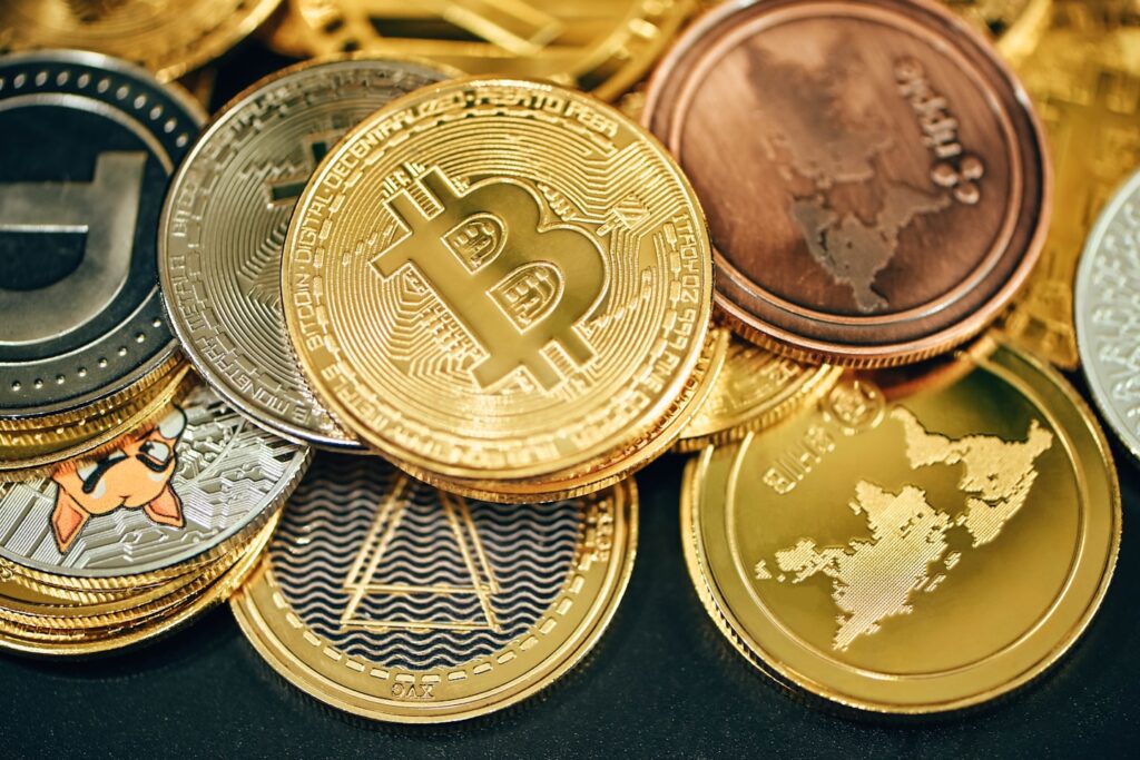 A pile of cryptocurrencies placed on a black background